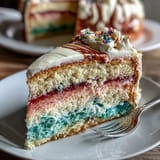 Elegant Spring Ombre Cake in pastel pink and yellow, with silky buttercream frosting and smooth gradient layers.