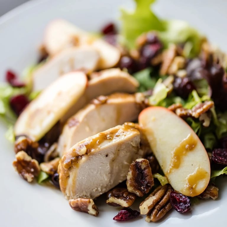 Freshly prepared Caramel Apple Chicken Salad with bright apples, savory chicken, and a glossy, sweet-savory dressing.